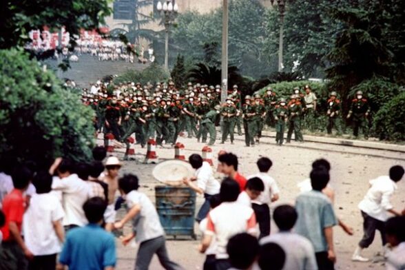 Chinese citizens and students of Chengdu, capital of Sichuan province, hurl stones at troop on June 4, 1989 during a rioting following the proclamation of the martial in the city. A series of pro-democracy protests was sparked by the April 15 death of former communist party leader Hu Yaobang. In a show of force, China leaders vented their fury and frustration on student dissidents and their pro-democracy supporters. Several hundred people have been killed and thousands wounded when soldiers moved on Tiananmen Square during a violent military crackdown ending six weeks of student demonstrations, known as the Beijing Spring movement. According to Amnesty International, five years after the crushing of the Chinese pro-democracy movement, "thousands" of prisoners remained in jail. AFP PHOTO STAFF / AFP PHOTO / -        (Photo credit should read -/AFP/Getty Images)